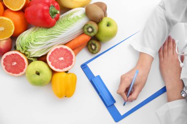 Nutritionist doctor writing diet plan  clipart