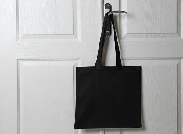 Textile bag hanging on door — Stock Photo, Image