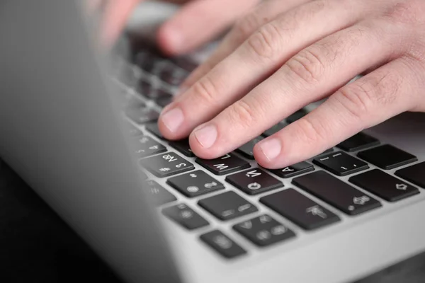Male hands on laptop keyboard — Stock Photo, Image