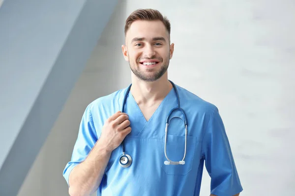Young medical assistant with stethoscope