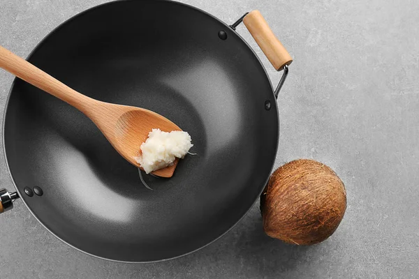 Coconut oil in wok — Stock Photo, Image