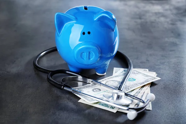 Piggy bank with stethoscope — Stock Photo, Image