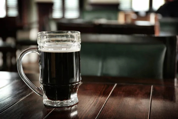 Glass of beer on table — Stock Photo, Image