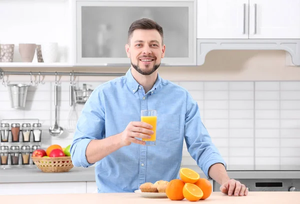 stock image Handsome man posing with juice