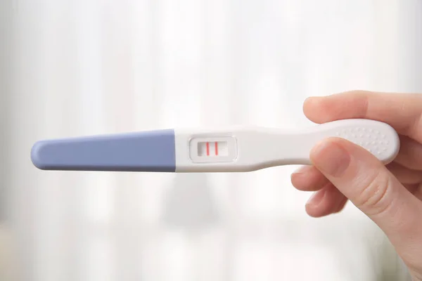 Pregnancy test in female hand — Stock Photo, Image