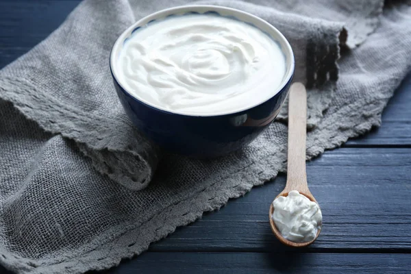 Bowl and spoon of homemade yogurt — Stock Photo, Image