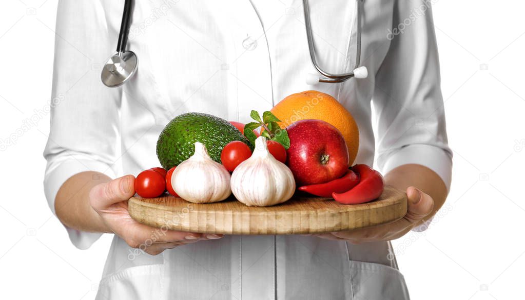 Doctor holding board with healthy food