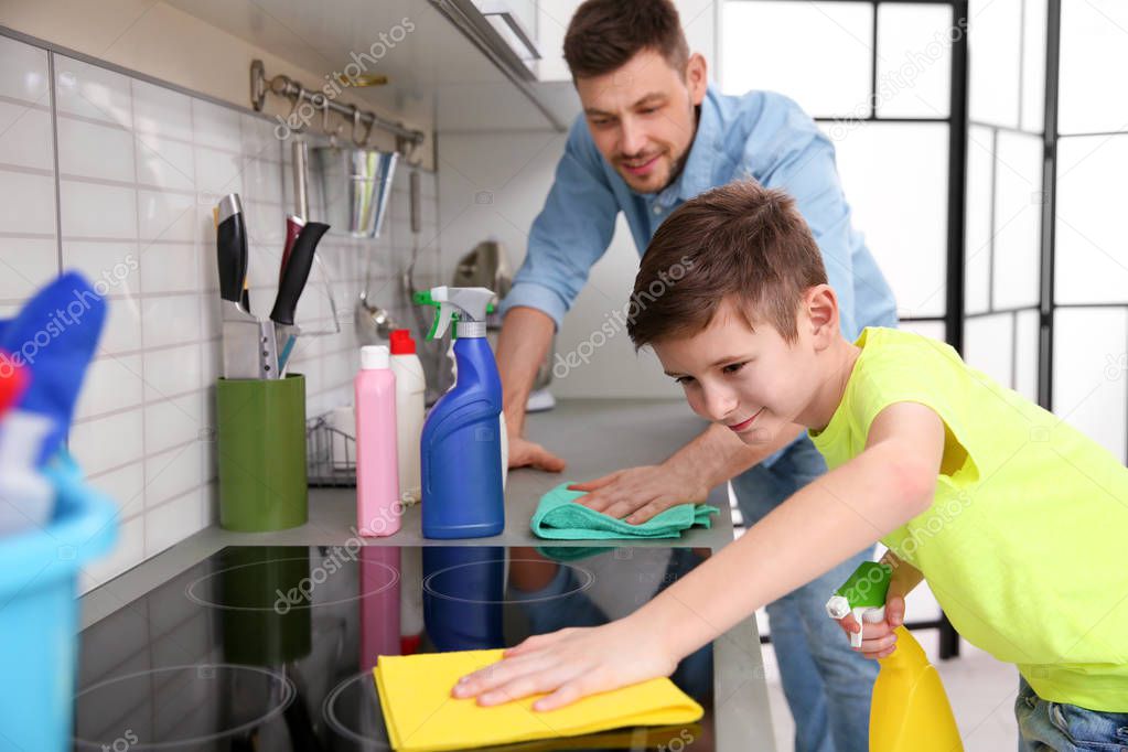 Dad and son doing cleaning