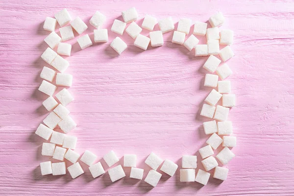 Square frame of sugar cubes — Stock Photo, Image