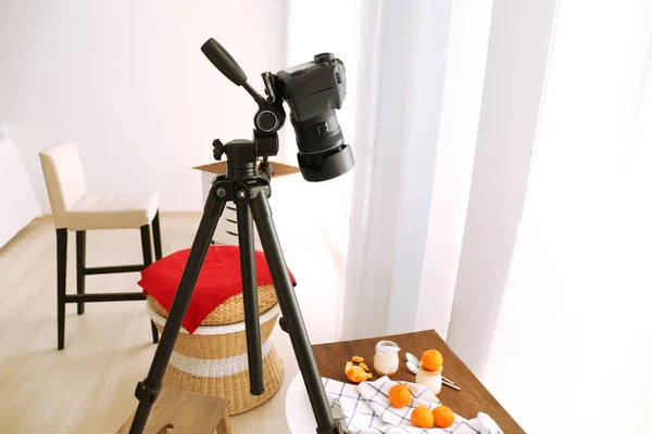 camera on tripod shooting food