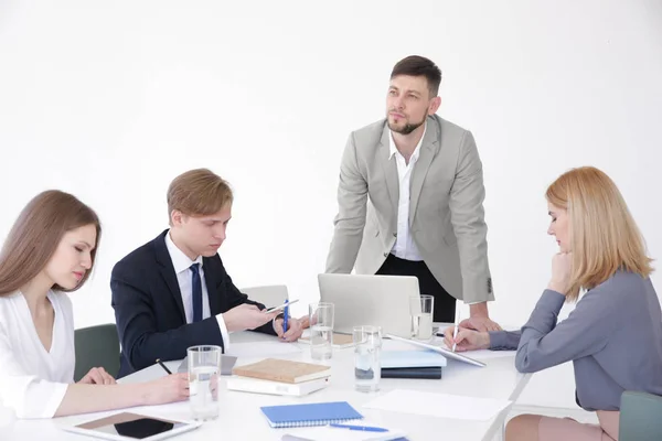 Business trainer giving presentation to group of people