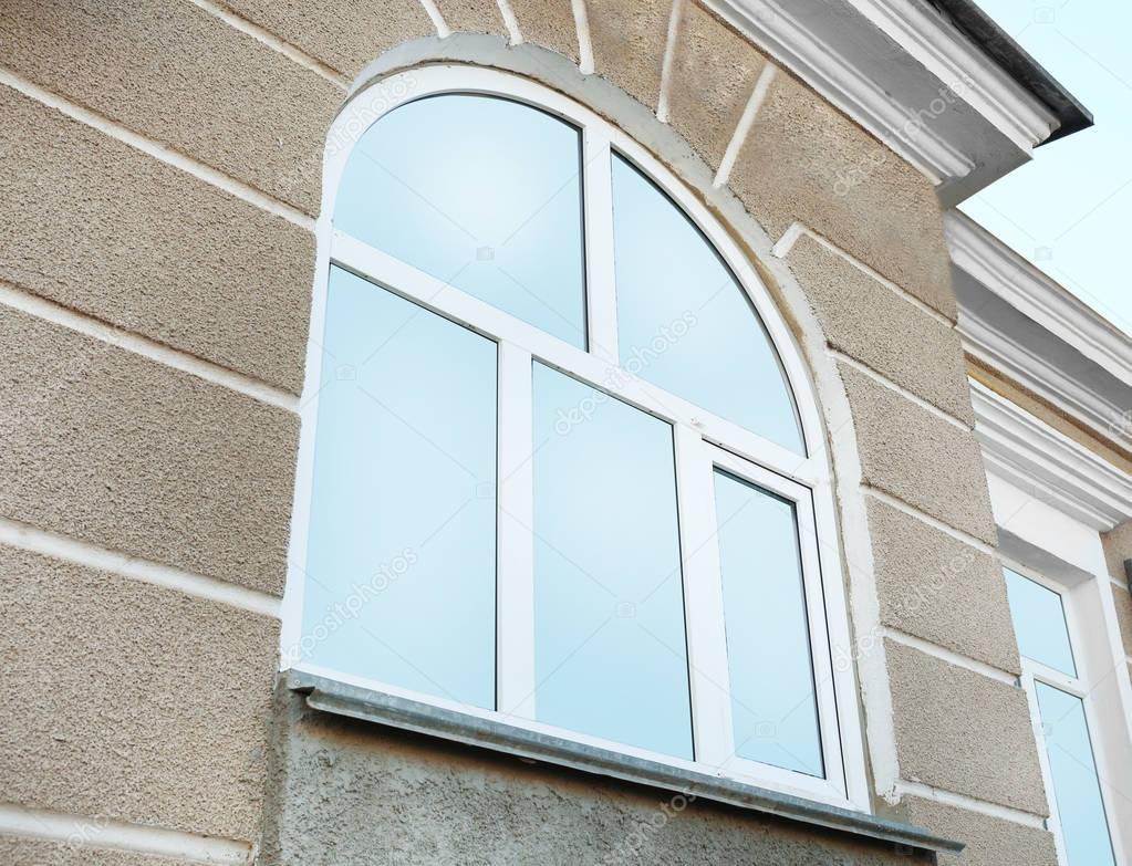 Arched window with tinted glass