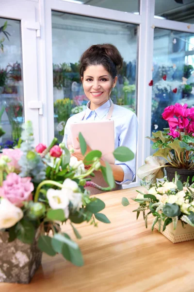 Beautiful woman florist — Stock Photo, Image