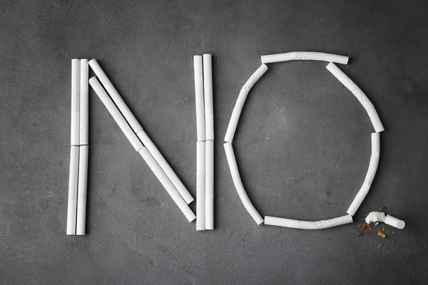 Palabra NO con cigarrillos —  Fotos de Stock
