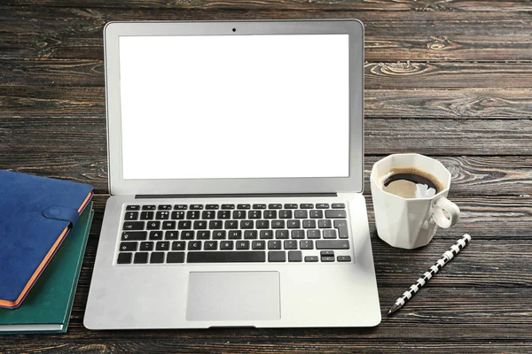 Laptop and cup of coffee — Stock Photo, Image