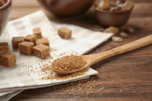 Brown sugar and spoon — Stock Photo, Image