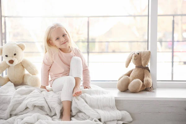 Girl sitting on windowsill — Stock Image Girl sitting on windowsill Stock Image
