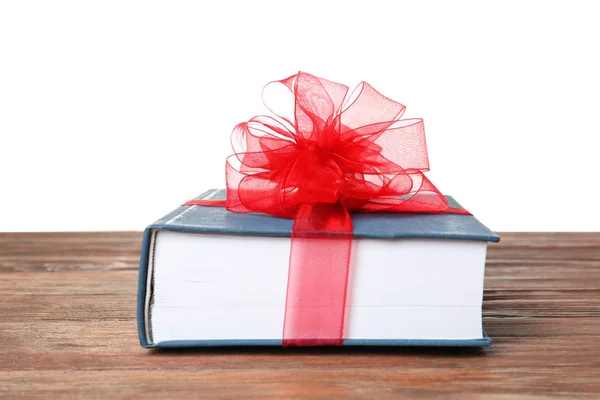 Book with ribbon as gift — Stock Photo, Image