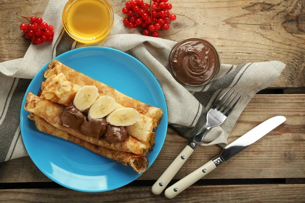 Pancakes with chocolate and banana — Stock Photo, Image