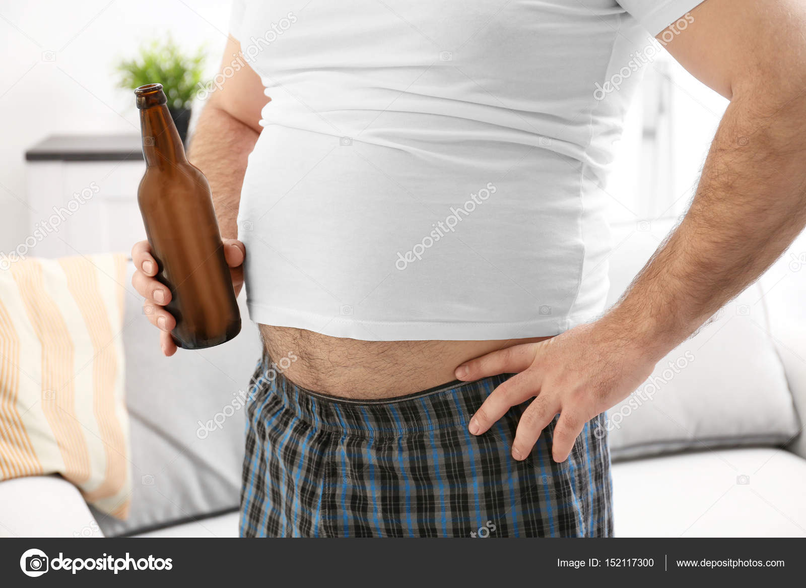 Man with big belly holding beer Stock Photo by ©belchonock 152117300