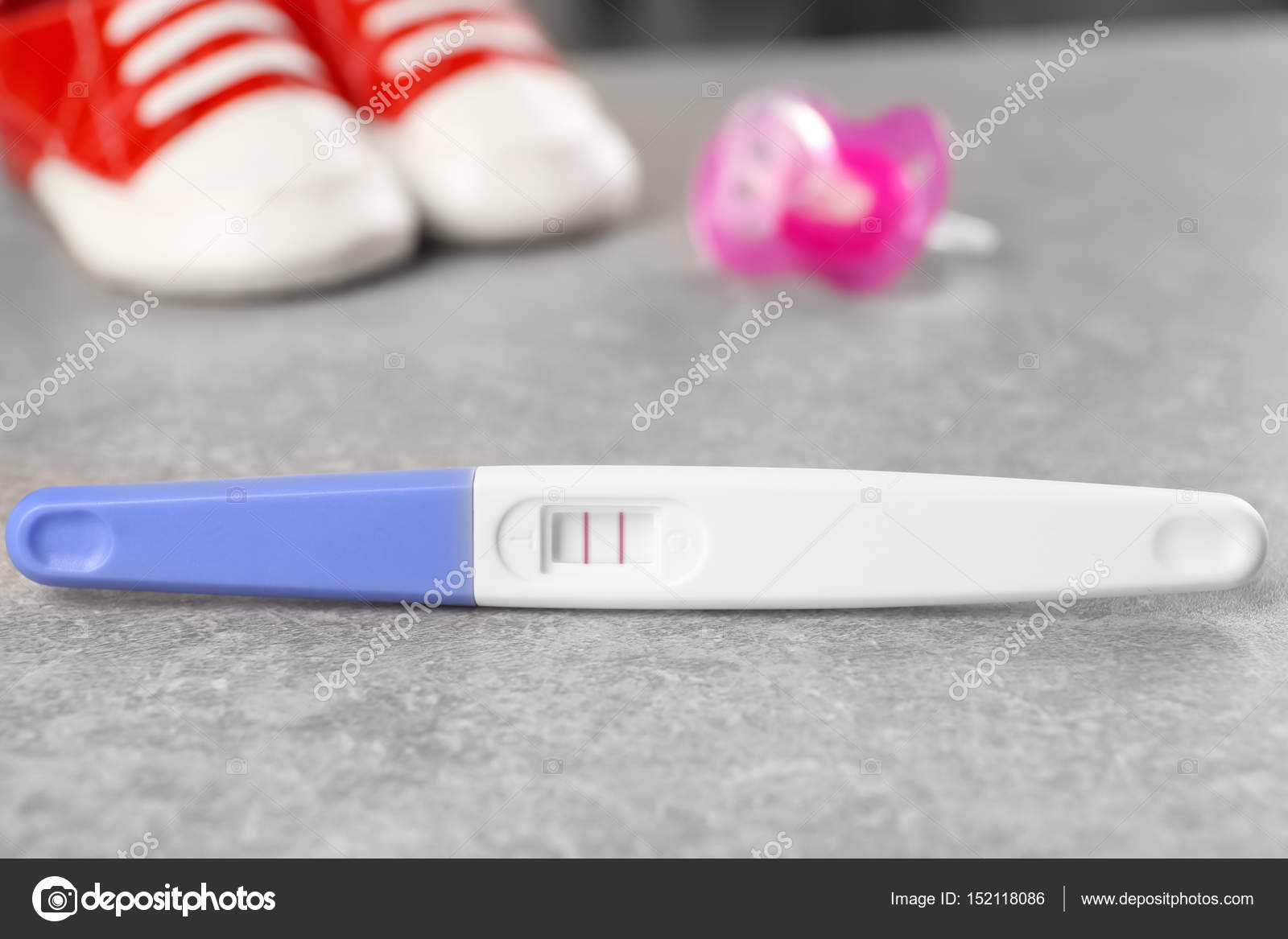 Pregnancy Test And Baby Shoes Stock Photo By C Belchonock