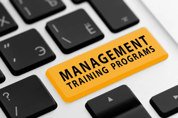MANAGEMENT TRAINING PROGRAMS button on keyboard