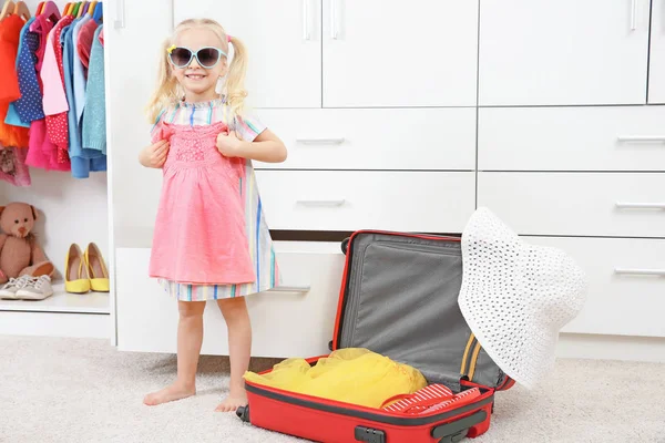 Cute girl in wardrobe — Stock Photo, Image