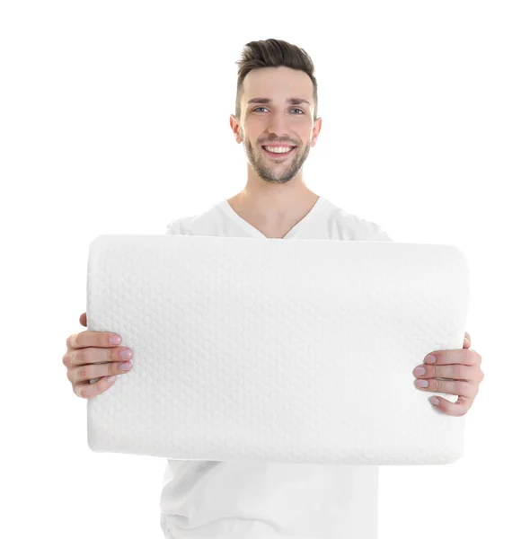 Young man with orthopedic pillow — Stock Photo, Image