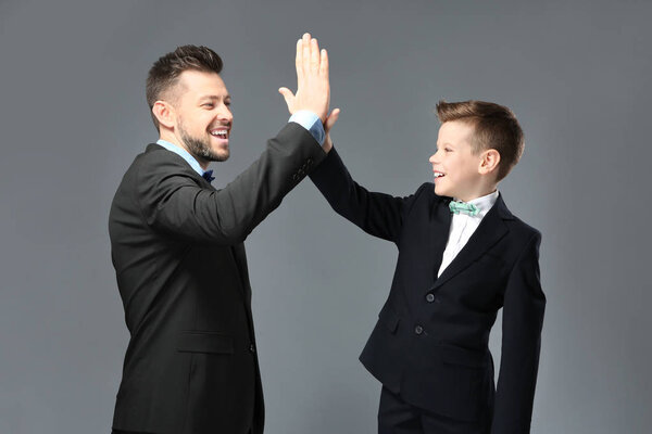 Father and son dressed in suits 