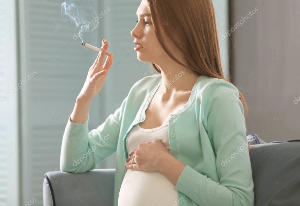 Pregnant woman smoking — Stock Photo © belchonock #152111282 Pregnant woman smoking — Stock Photo © belchonock #152111282