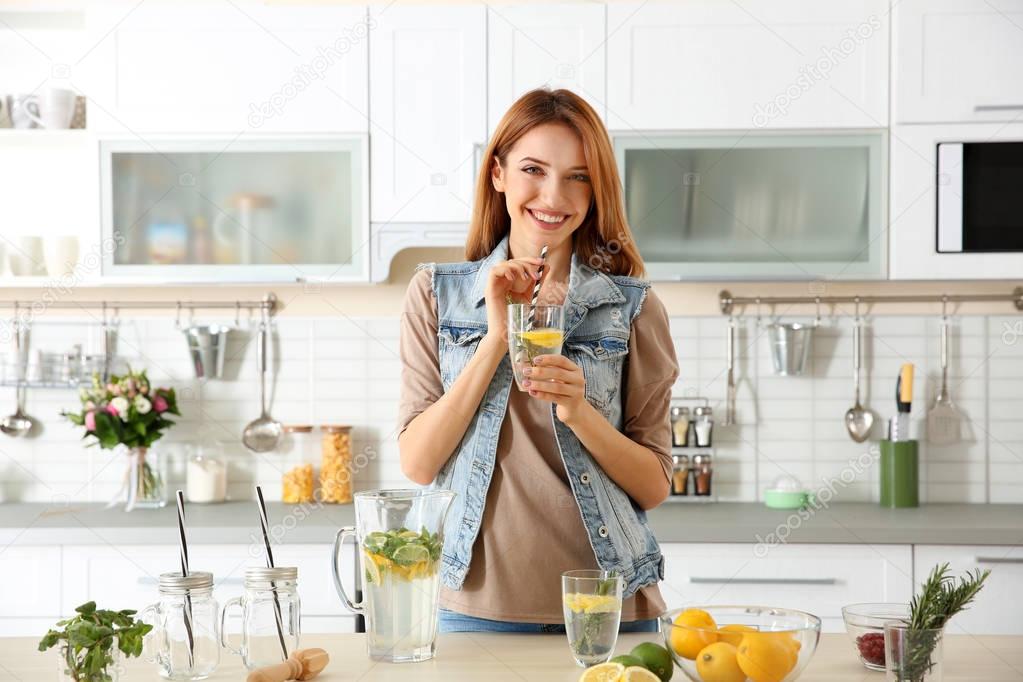 Beautiful young woman with lemonade 
