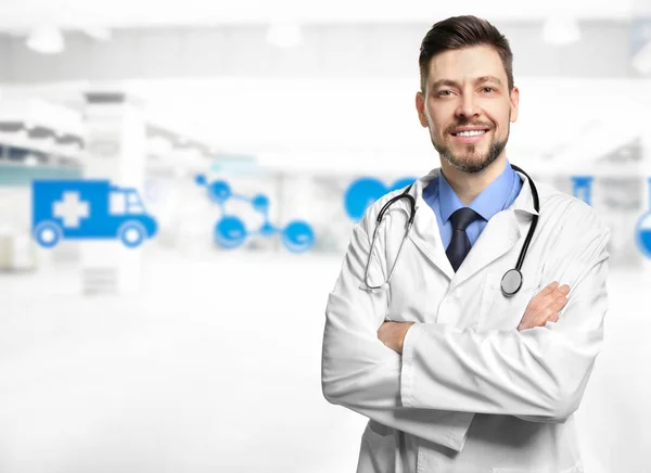 Doctor on blurred hospital background — Stock Photo, Image