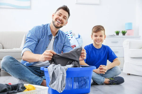 Dad and son preparing clothes