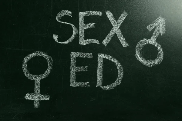 School blackboard with text SEX ED and drawn gender symbols, closeup — Stock Photo, Image