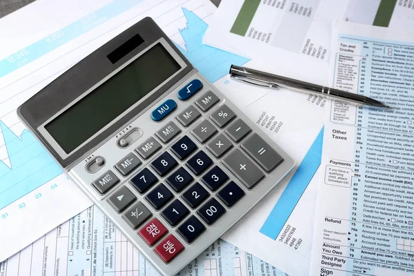 Calculator with documents and pen on table. Tax concept — Stock Photo, Image