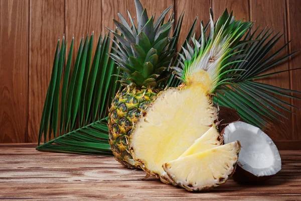sliced pineapples and fresh coconut