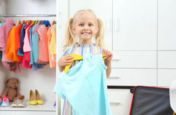 Cute girl in wardrobe — Stock Photo, Image