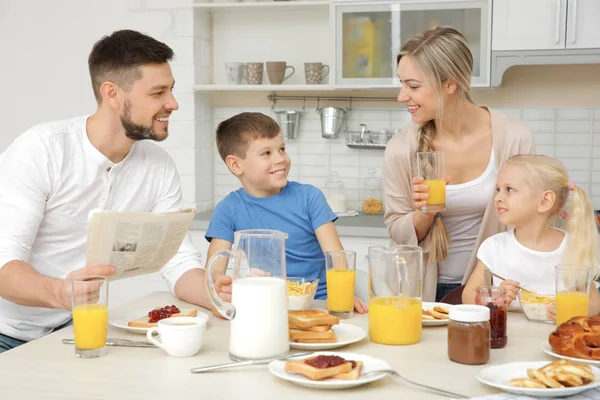 Happy family having breakfast on kitchen — Stock Photo, Image