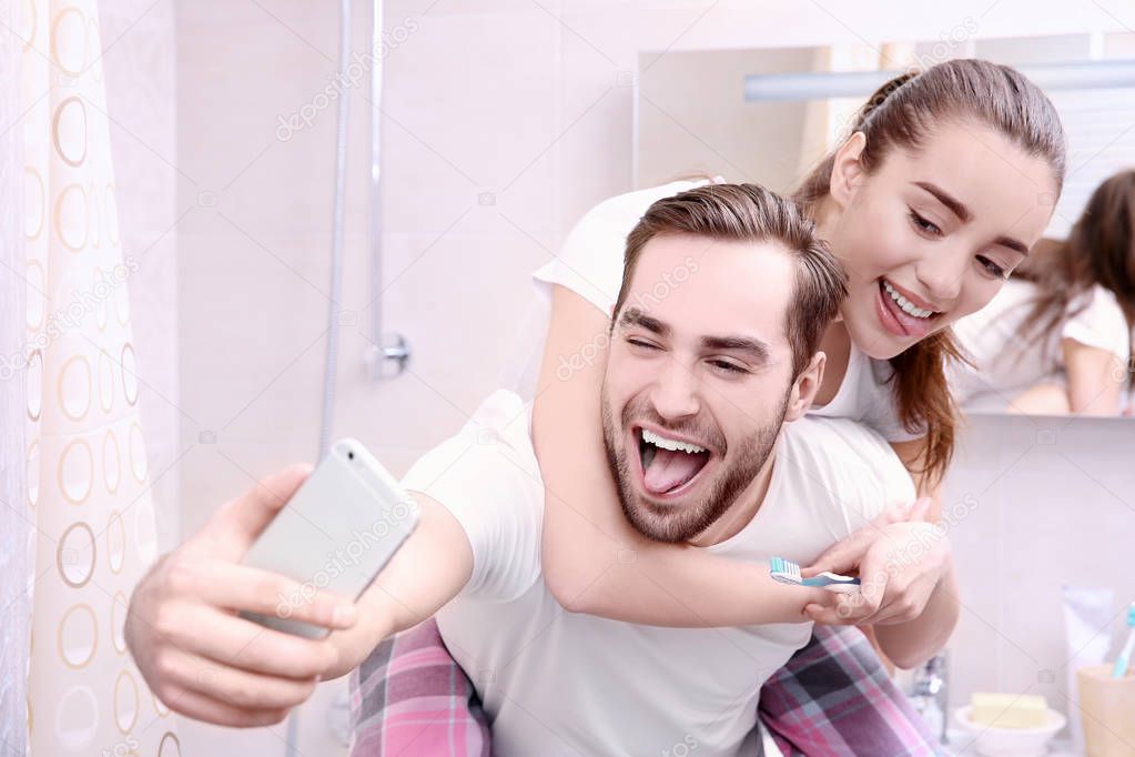 Young couple taking selfie