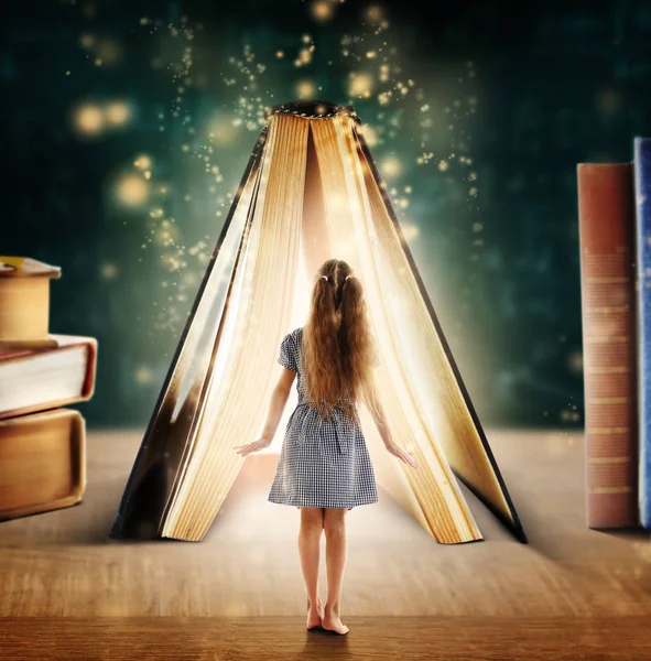 Tiny girl and book with magic glowing on table