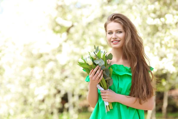 Beautiful woman with bouquet of tulips — Stock Photo, Image