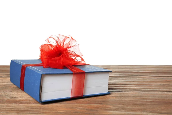 Kniha jako dárek s mašlí — Stock fotografie