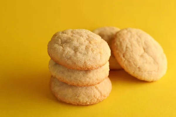 Sugar cookies on yellow background — Stock Photo, Image