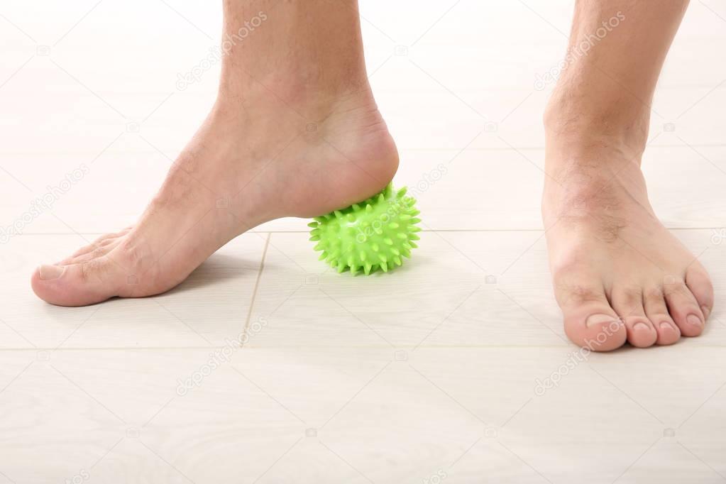Feet of man doing exercises  