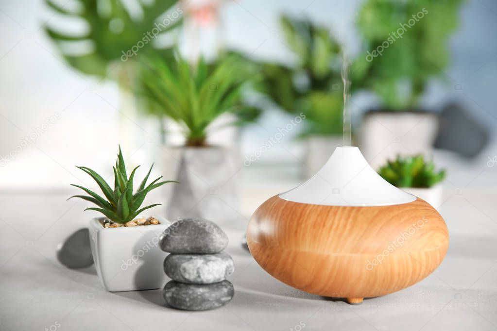 Oil diffuser on background