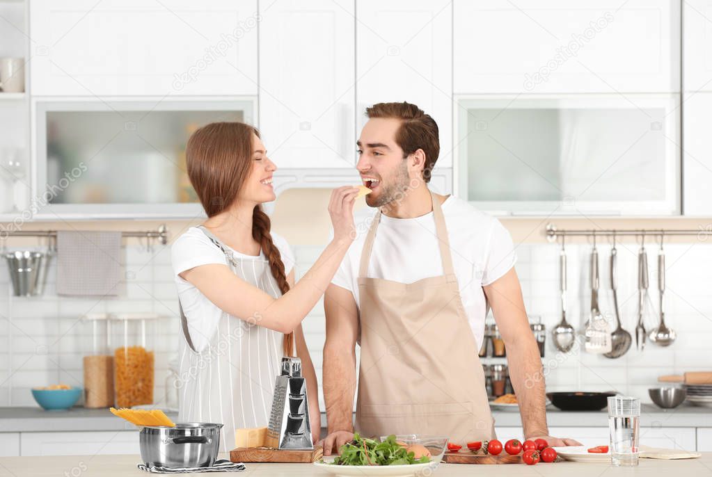 Young couple preparing pasta 