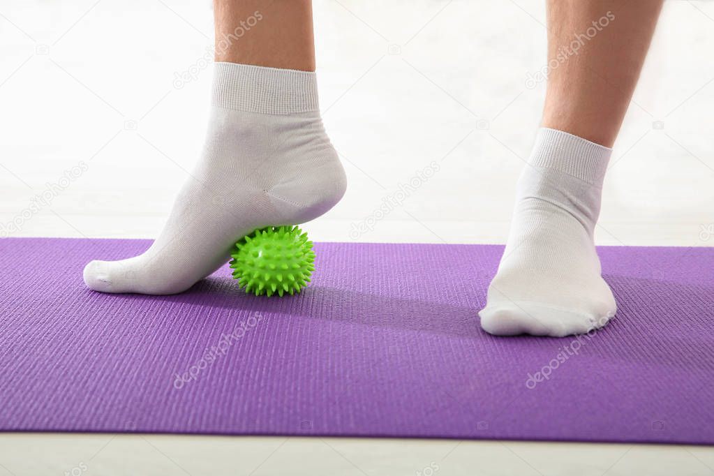 Feet of man doing exercises  