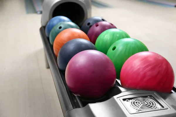 Colorful balls on rack — Stock Photo, Image