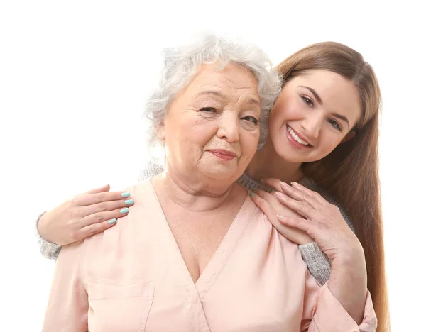 Красивая девушка с бабушкой на белом фоне — стоковое фото
