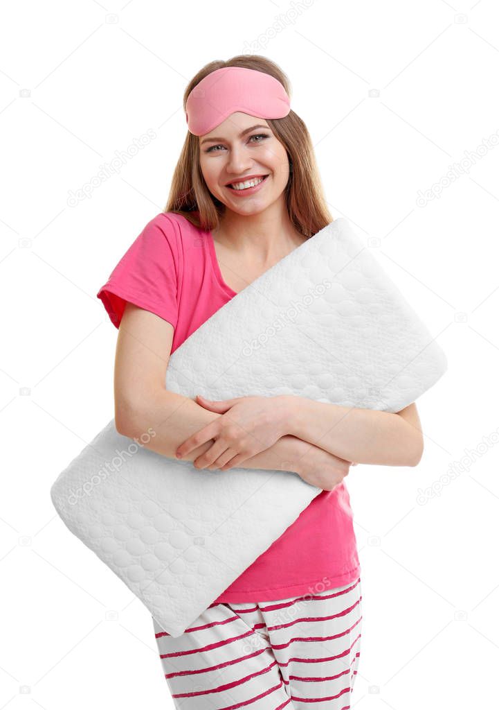 Young woman holding orthopedic pillow 